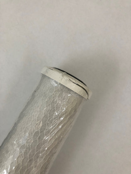 CM1 filter showing heavy damage and wear for disposal or replacement consideration.