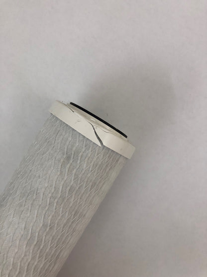 CM1 damaged filter angle view highlighting wear and tear for replacement guidance.